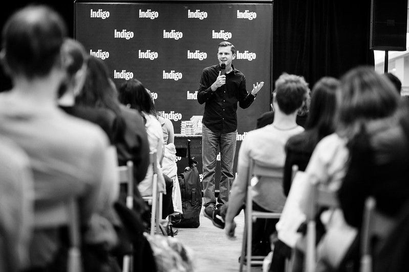 Chris Guillebeau speaking at a community book event